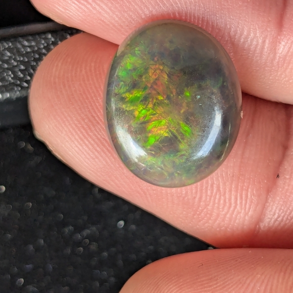 5.85ct Natural play of color black opal - Picture 13 of 16